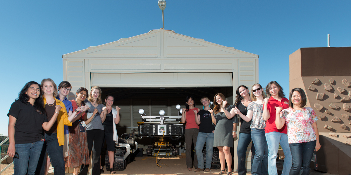 shot of mars women with rover in garage