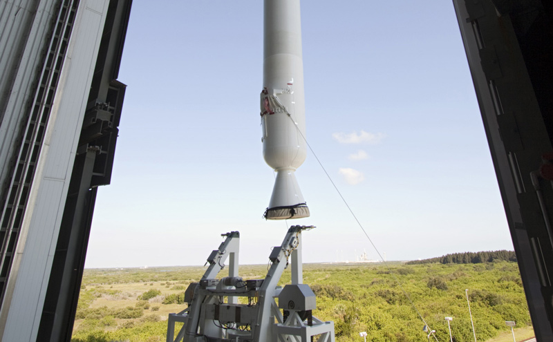 With a view taken from inside the Vertical Integration Facility at Space Launch Complex 41 on Cape Canaveral Air Force Station in Florida, the final solid rocket motor (SRM) hangs in an upright position for mating to a United Launch Alliance Atlas V rocket which will carry NASA's Mars Science Laboratory (MSL) mission.