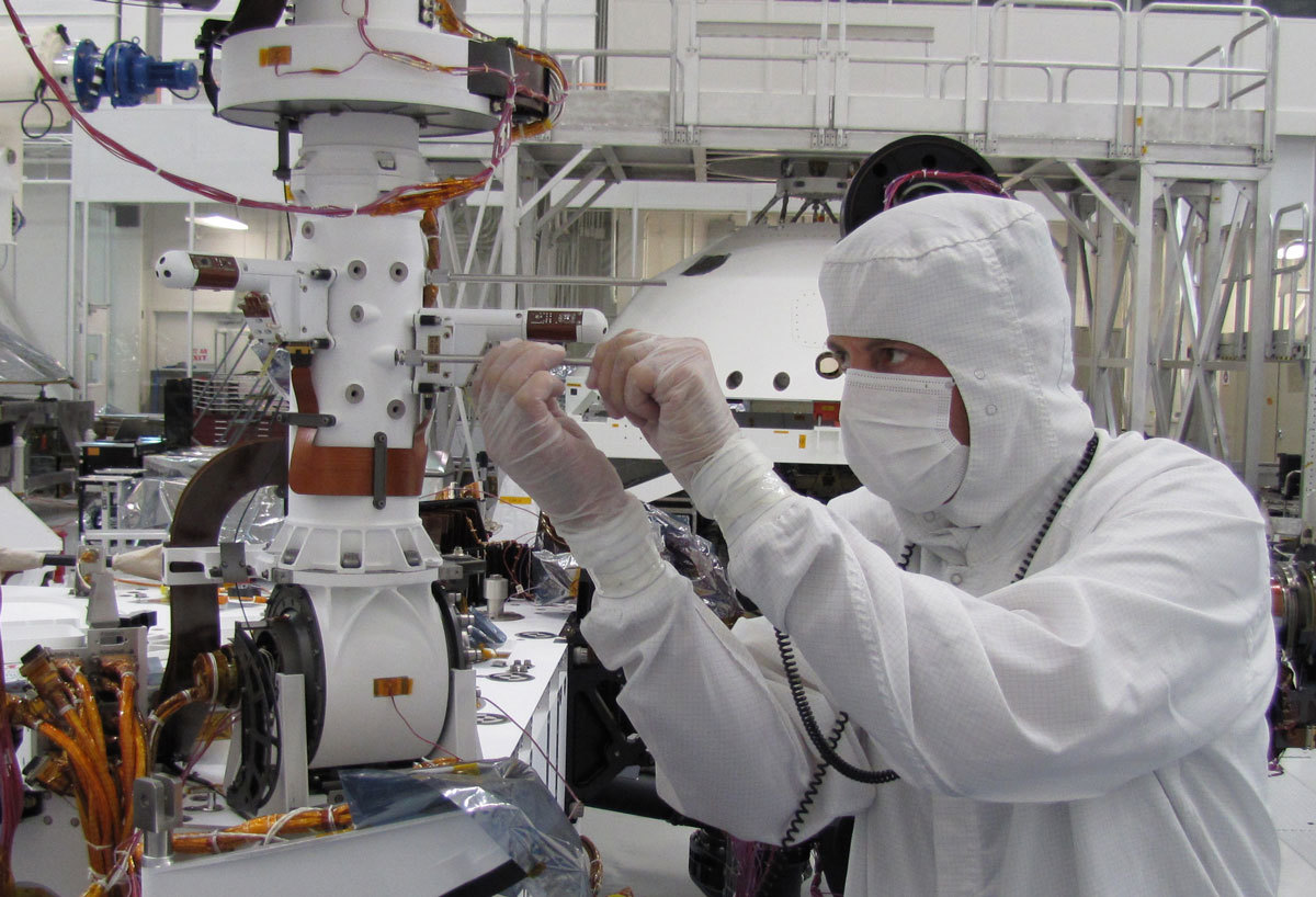 Sensors on two finger-like mini-booms extending horizontally from the mast of NASA's Mars rover Curiosity will monitor wind speed, wind direction and air temperature. One also will monitor humidity; the other also will monitor ground temperature. The sensors are part of the Rover Environmental Monitoring Station, or REMS, provided by Spain for the Mars Science Laboratory mission.