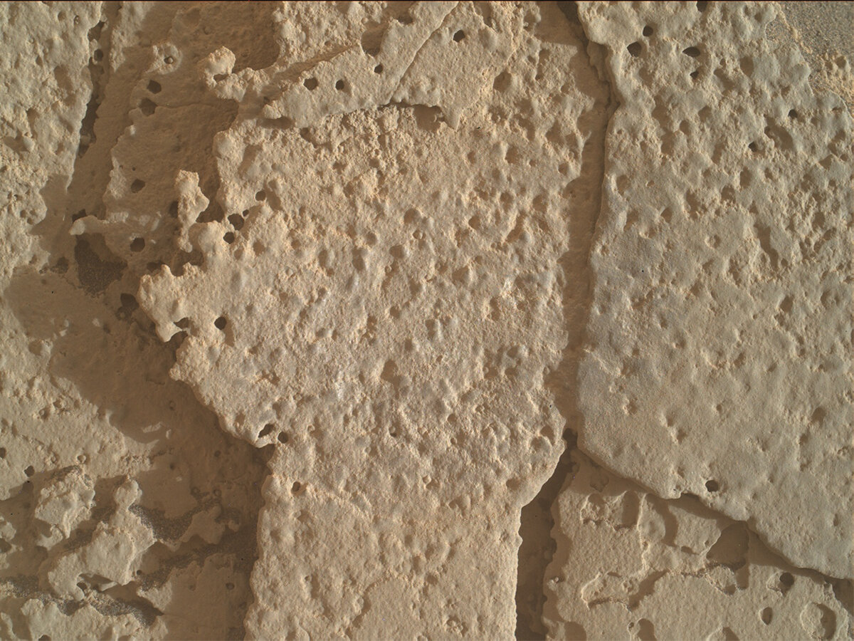 A MAHLI image of “Wren Peak," a pitted rock feature on Mars, before brushing.