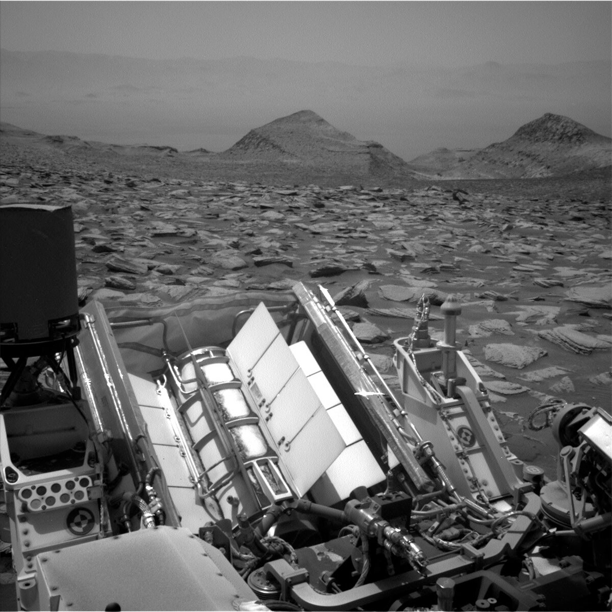 This image of the Curiosity rover looking back at a field of rocks and distant hills was taken by its Left Navigation Camera on Sol 4057.